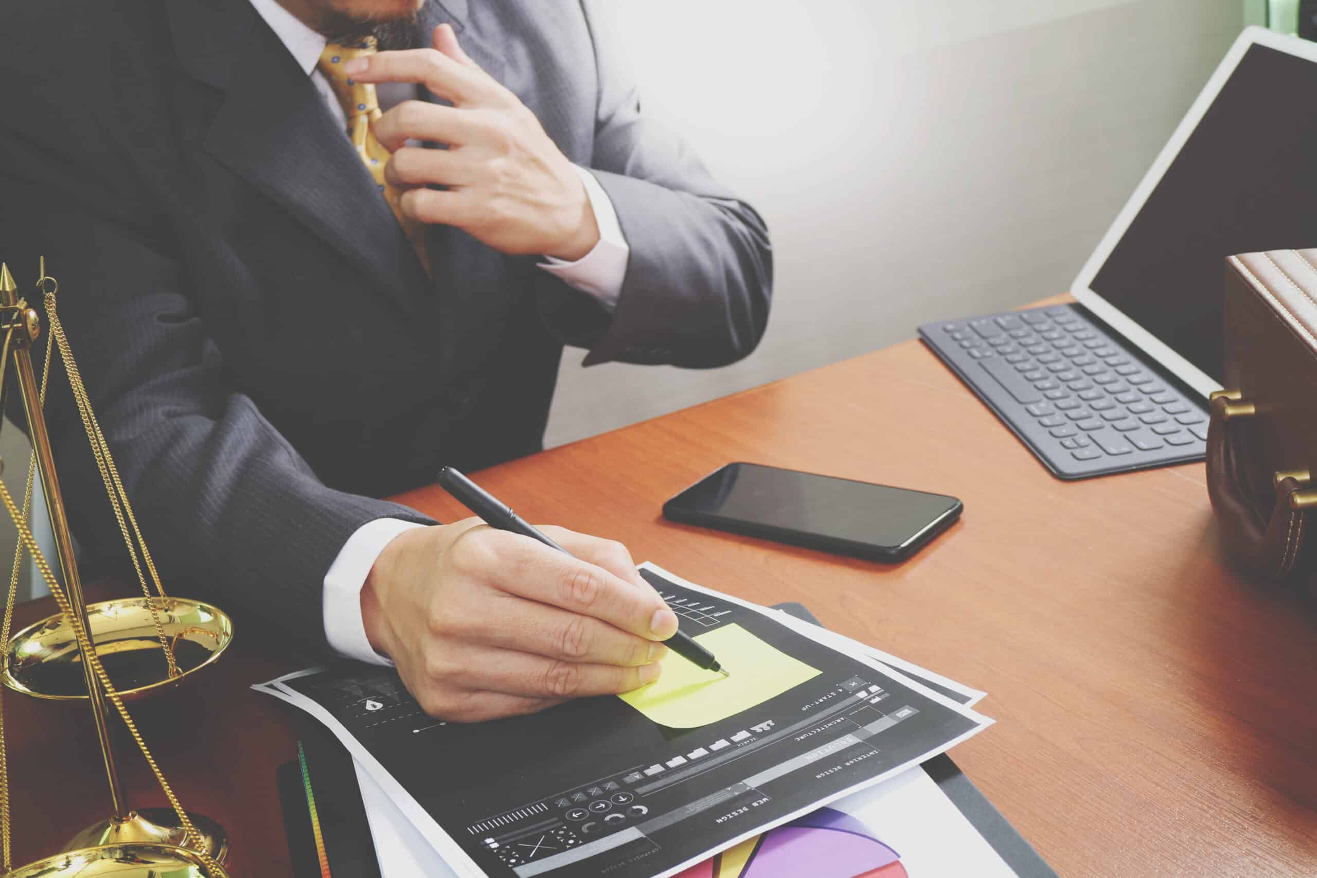 facebook advertising for lawyers - justice and law concept.Male lawyer in the office with brass scale on wooden table