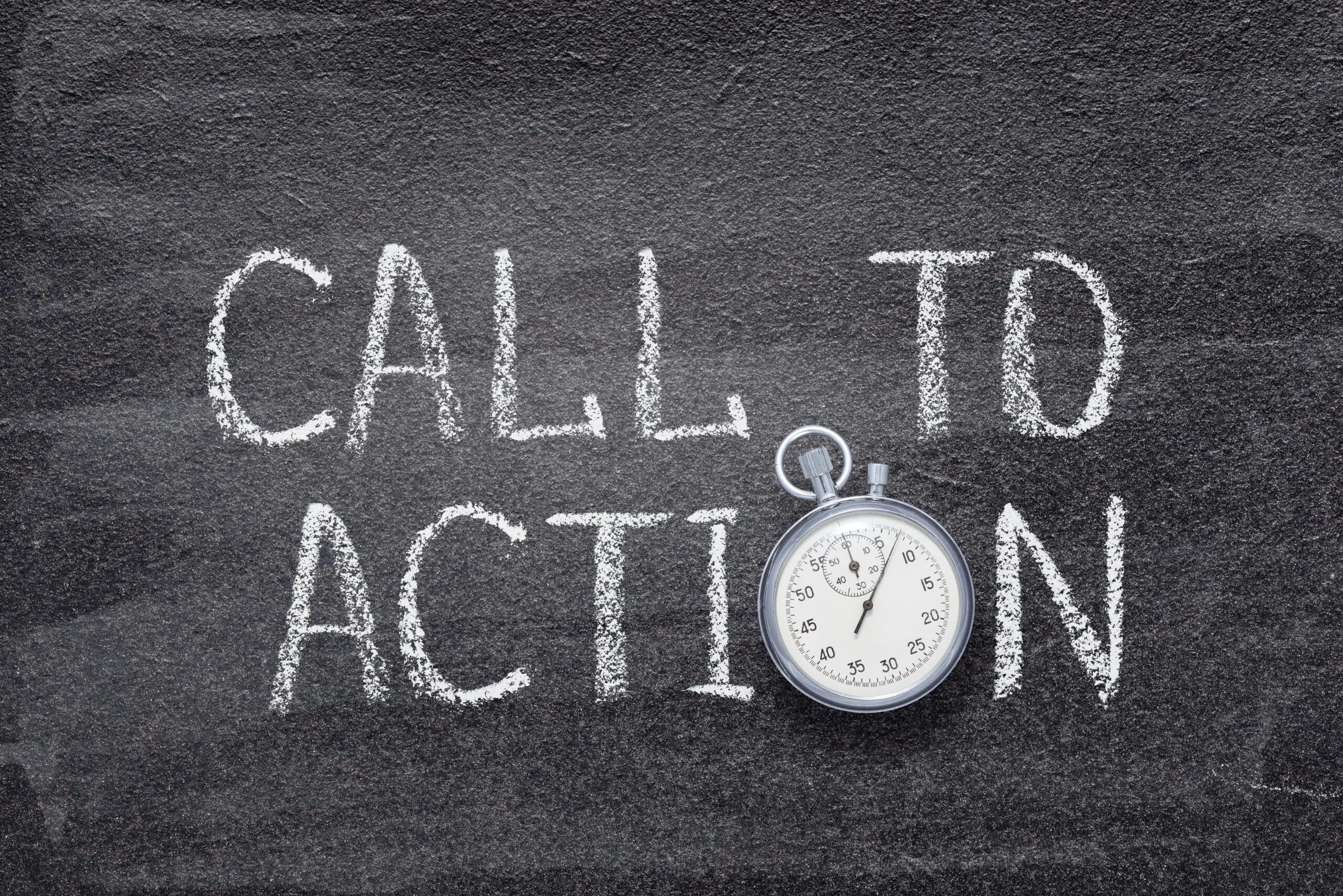 call to action written on chalkboard with vintage stopwatch