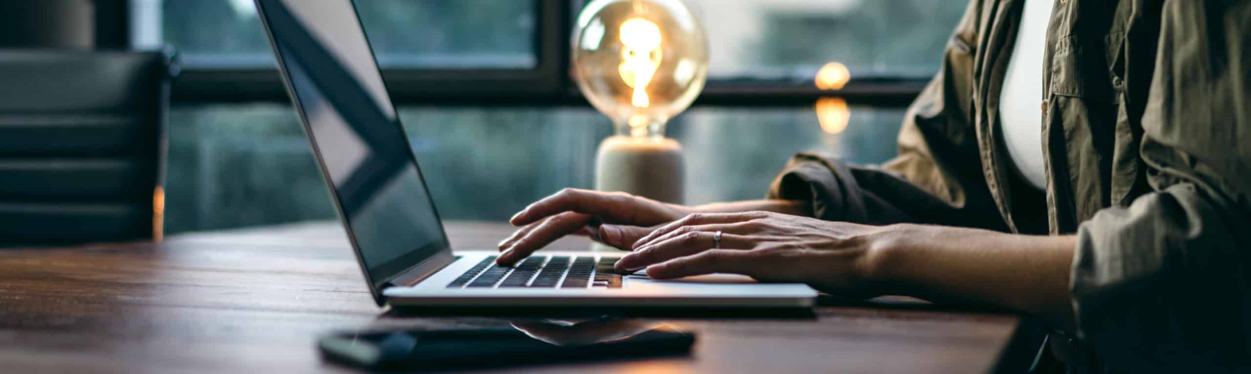 a woman blogging and creating high-quality content