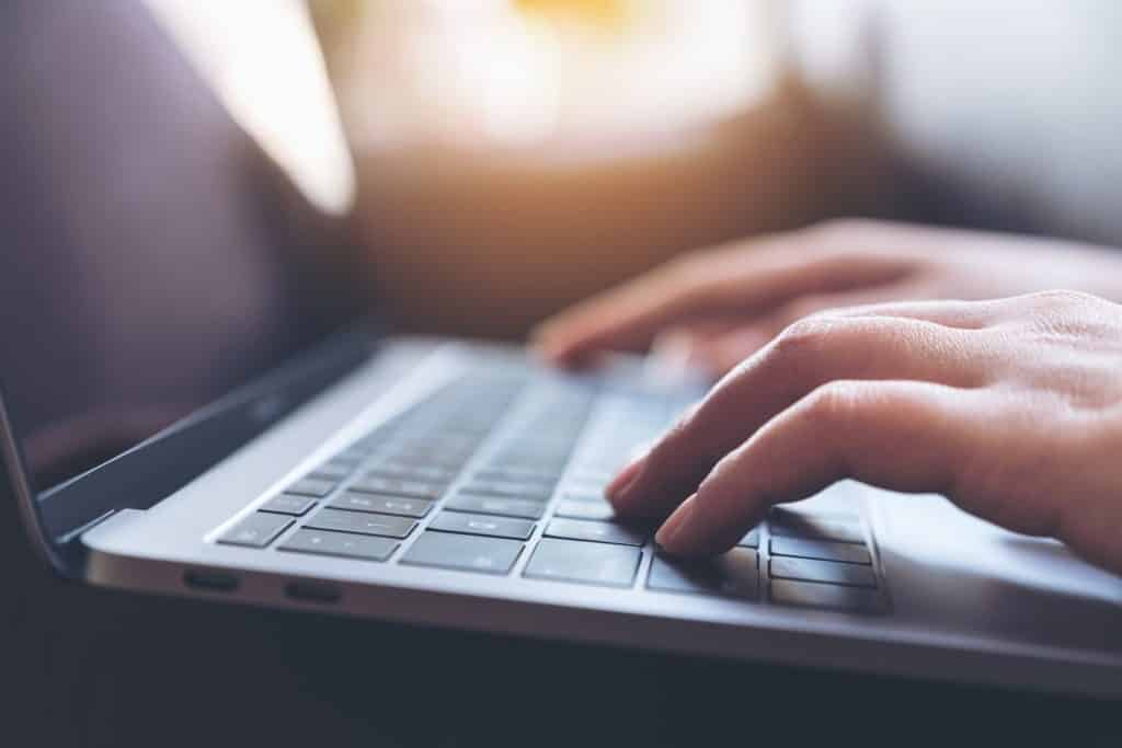 Someone writing an informational blog post as content for the awareness stage of the buyer's journey.