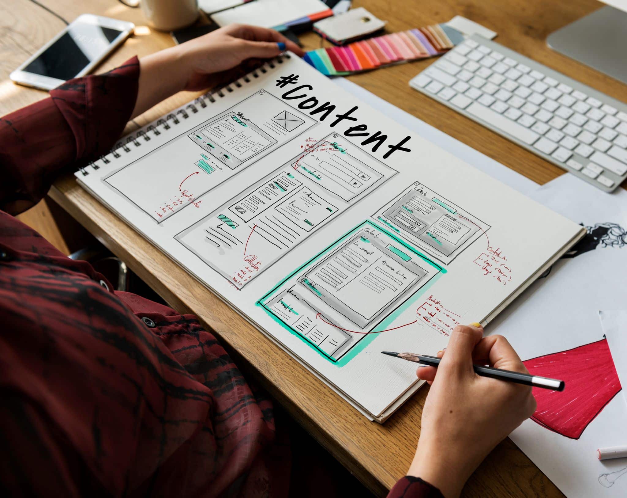 businesswoman planning over her website's content on her notebook